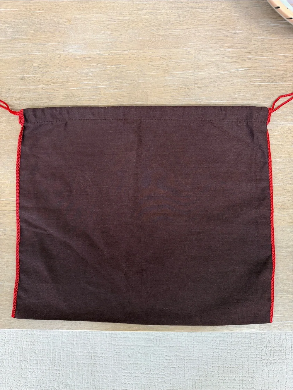 Coach 15.5” x 13.5” dust bag, brown with red edging and white lettering